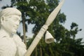 Artificial statue of an old soldiers standing with weapons of India
