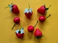 Artificial strawberries and cherries fruit isolated on orange background