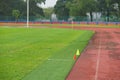 Artificial track and field with green grass combined with artificial grass