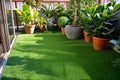 artificial turf balcony garden with potted plants Royalty Free Stock Photo