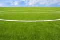 Artificial turf football field green on sky background