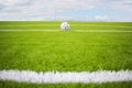 Artificial turf football field green on sky background Royalty Free Stock Photo