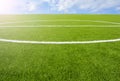 Artificial turf football field green on sky background Royalty Free Stock Photo