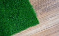Artificial turf on wood tile Royalty Free Stock Photo