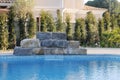 Artificial Waterfall over Blue Pool - Home - Luxury