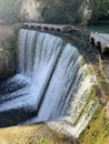 Artificial waterfall on the river Psyrtskha in the summer, the city of New Athos, Abkhazia