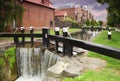 Artificial waterfall and river. small houses