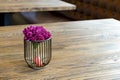 Artificial wood flowerpot on wooden table, small light brown colArtificial wood flowerpot on wooden table, small light brown colou Royalty Free Stock Photo