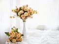 Artificial yellow rose flowers bouquet in vase on table, copy space for text or writing ,pretty texture background or wallpaper Royalty Free Stock Photo