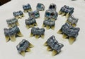 Artificially designed teeth models are displayed on a white surface. Each model features multiple Royalty Free Stock Photo