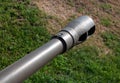 Artillery gun barrel close up. Muzzle brake on cannon barrel green colored Royalty Free Stock Photo