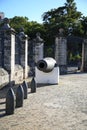 Artillery shells and fortress cannon near the fence on a sunny day. Havana Royalty Free Stock Photo