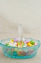 Artisan, blue, glass easter basket, filler with colorful, easter, candy Royalty Free Stock Photo