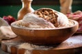 artisan bread dough rising in a wooden bowl Royalty Free Stock Photo