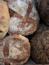 Artisan bread loafs closeup with white flour and sesame seeds