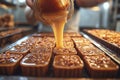 Artisan candy maker pouring caramel into molds for delicious soft caramels in workshop setting Royalty Free Stock Photo