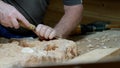 Artisan carves pattern, Master woodworker skillfully creates elegant motifs using precise tools, Seasoned craftsman Royalty Free Stock Photo