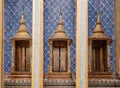 Artisan ceramic facade and golden window of Bangkok Grand Palace