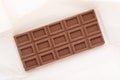 Artisan chocolate bar on white. Raw vegan handmade chocolate