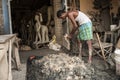 The artisan of clay idol maker preparing clay for idols.