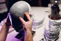 Artisan craftsman create mask based on plaster cast. Gypsum mold and plastic mask sculpting
