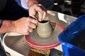 Artisan creates a clay pot with a lathe