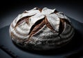 Artisan dark rye sourdough bread loaf with a heavily floured and deeply scored crust Royalty Free Stock Photo