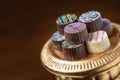 Artisan Fine Chocolate Candy On Gold Pillar Serving Dish