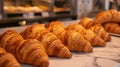 Artisan Golden-Brown Croissants Fresh from the Oven Displayed on a Chic Marble Countertop - Ideal for Bakery Promotions Royalty Free Stock Photo