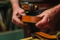artisan handcrafting a leather belt Royalty Free Stock Photo