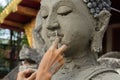 Artisan hands making clay buddha