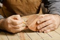 Artisan hands sketching on wood billet Royalty Free Stock Photo