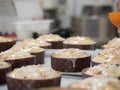 artisan italian baker preparing panettone christmas cake adding sugar sprinles