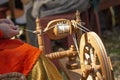 Artisan makes yarn with spinning wheel Royalty Free Stock Photo