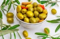 Artisan olives canned in extra virgin olive oil, vinegar, spices with red peppers and garlic. Appetizer concept. Royalty Free Stock Photo