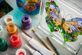 Artisan painting with stained glass paints. Royalty Free Stock Photo