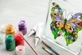 Artisan painting with stained glass paints. Royalty Free Stock Photo