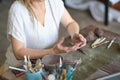 artisan pottery tutor in art studio. woman ceramist teaches an online lesson or leads a video master class on creating