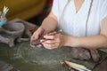 artisan pottery tutor in art studio. woman ceramist teaches an online lesson or leads a video master class on creating