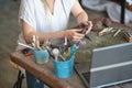 artisan pottery tutor in art studio. woman ceramist teaches an online lesson or leads a video master class on creating