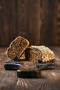 Artisan rye bread with dried apricots, prunes and seeds cut on half Royalty Free Stock Photo