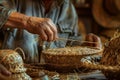 Artisan's hands weaving intricate patterns in traditional basket making process Royalty Free Stock Photo