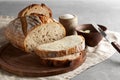 Artisan sliced toast bread with butter and sugar on wooden cutting board. Simple breakfast on grey concrete background Royalty Free Stock Photo