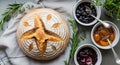 Artisan sourdough bread with assorted fruit preserves and fresh herbs Royalty Free Stock Photo