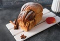 Artisan sourdough cinnamon swirl bread on wooden rack Royalty Free Stock Photo