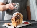 Artisan sourdough cinnamon swirl bread on wooden rack Royalty Free Stock Photo