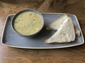 Vegetable Soup and White Bread Slices on a Table in a Cafe Royalty Free Stock Photo