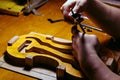 artisan violin maker luthier working on violin center bot, corner blocks , bend ribs for a new classic handmade violin