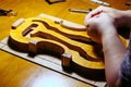 artisan violin maker luthier working on violin center bot, corner blocks , bend ribs for a new classic handmade violin