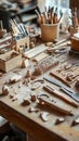 Artisan woodworking desk with tools and wooden models Royalty Free Stock Photo